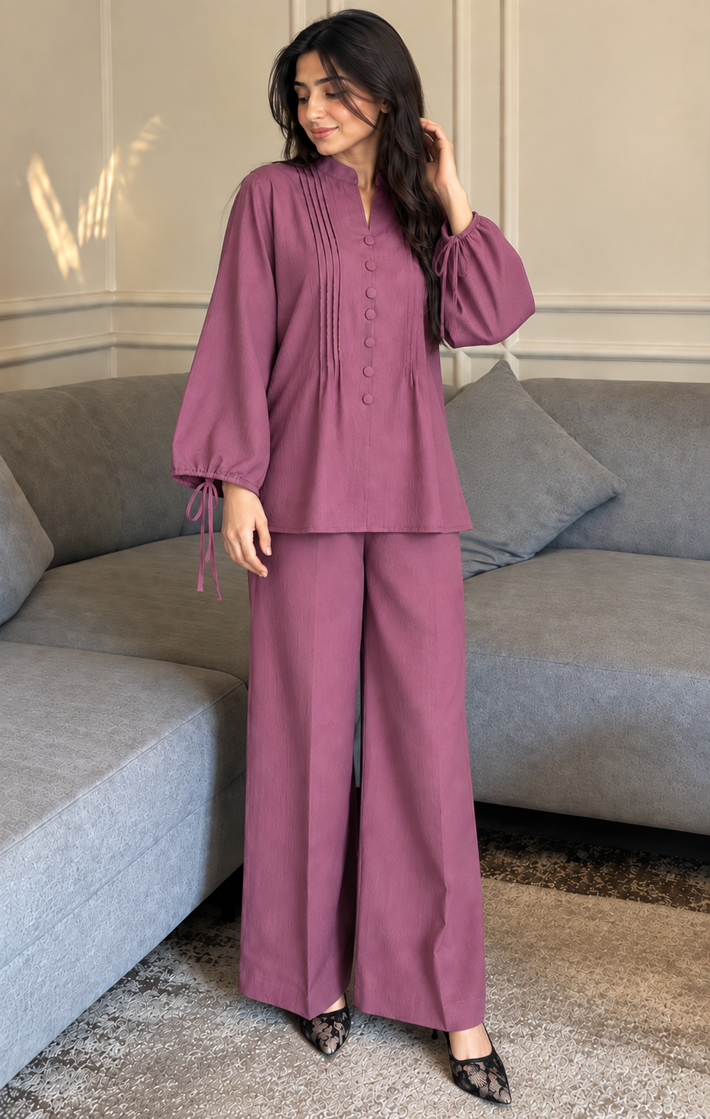 Woman wearing Numaish dusty rose linen co-ord set with pintuck top, tie-cuff balloon sleeves and wide-leg trousers